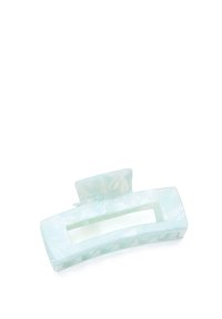 Ljusgrön hårklämma i marmorplast. Rektangulär form med en central öppning och texturerat grepp på undersidan.