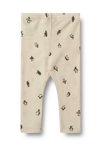 Helle beige Leggings aus weichem Stoff, mit einem wiederholten Pinguin-Druck in Dunkelbraun und Schwarz, elastischem Taillenbund und gesäumten Kanten.