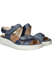 Marine leren sandalen met open teen en enkelbandjes, voorzien van een gestructureerde witte zool en een gevoerd kurken voetbed voor comfort.