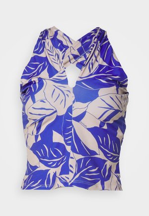 Zils halter top ar lapu rakstu krēmkrāsā. Iezīmējas ar atslēgas caurumu aizmugurē un ručām sānos. Gluda tekstūra.