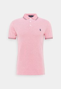 Roze polo shirt met een gestructureerde afwerking, korte mouwen, een drie knopenpels en contrasterende marineblauwe strepen op de kraag en manchetten. Voorzien van een logo.