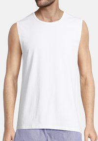 White sleeveless cotton tank top with a round neckline and a relaxed fit, featuring smooth texture and minimal detailing.