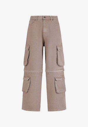 Spodnie cargo w jasnym beżowym twillowym bawełnianym materiale, charakteryzujące się luźnym krojem, wieloma bocznymi kieszeniami oraz wzmocnionymi szwami na dole.