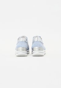 Light blue suede sneakers with metallic silver accents, featuring a thick white sole and a zip detail on the heel.