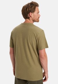 Olive green short-sleeve t-shirt with a crew neck, made of soft, textured material; back view shows a relaxed fit and subtle stitching details.