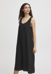 Rochie din in neagră, cu un design lejer, fără mâneci, având un decolteu rotund, croială dreaptă și margine la genunchi. Textură netedă, detalii minime.