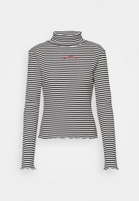 Haut à col roulé à manches longues rayé noir et blanc avec un ourlet festonné et un texte brodé rouge sur la poitrine. Fabriqué en tissu extensible.