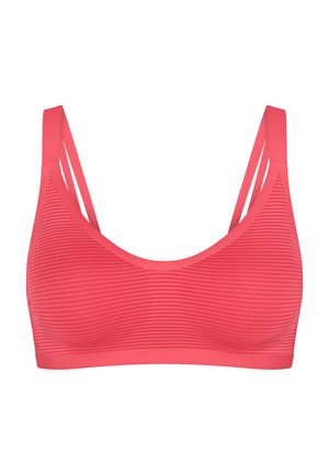 Coral pink seamless sports bra with thin double shoulder straps and horizontal stripe texture on fabric.