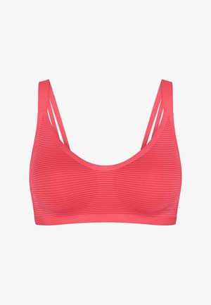 Korallyserød sports-bh uden syninger med tynde dobbelte skulderstropper og vandret stribet tekstur i stoffet.