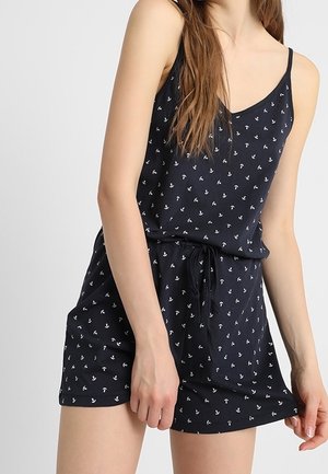 Marineblaues ärmelloses Kleid mit weißem Ankerdruck, Kordelzug in der Taille und lockerer Passform. Hergestellt aus weichem Stoff mit glatter Textur.