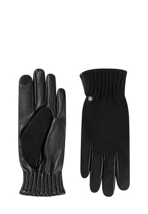 Black leather gloves with a smooth finish, ribbed cuffs, and a small silver emblem. Touchscreen-compatible fingertips on one glove.