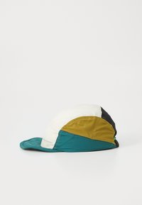 Colorful cap featuring a mix of white, teal, gold, and black panels. Soft fabric with a curved brim and a stitched logo tag on the side.