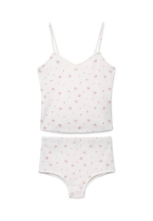 Canottiera bianca e slip abbinati con piccolo motivo floreale rosa, con sottili spalline e un discreto fiocco in vita sugli slip.