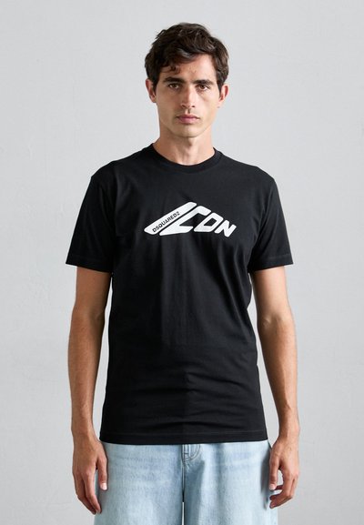 T-shirt en coton noir à manches courtes et col rond. Présente un logo graphique blanc proéminent sur le devant. Coupe standard, texture lisse.
