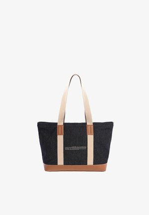 Bolsa tote negra y marrón con asas beige y el logo "Don Algodon" impreso en blanco en el centro delantero.