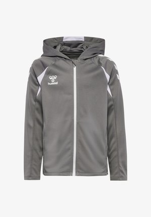 Grijze sportieve capuchonjas met witte ritssluiting en witte chevronstrepen op de mouwen, met het hummel-logo op de borst.