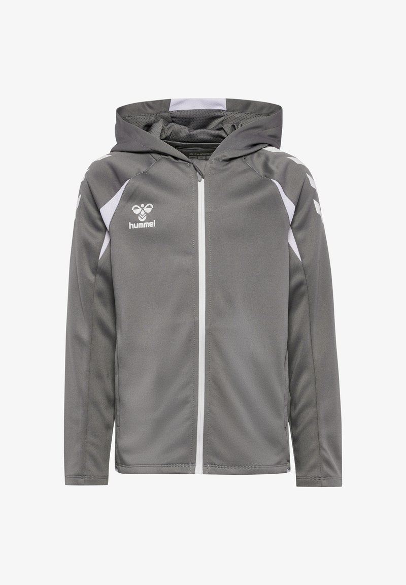 Veste de sport grise à capuche avec fermeture éclair blanche et bandes chevrons blanches sur les manches, avec le logo hummel sur la poitrine.