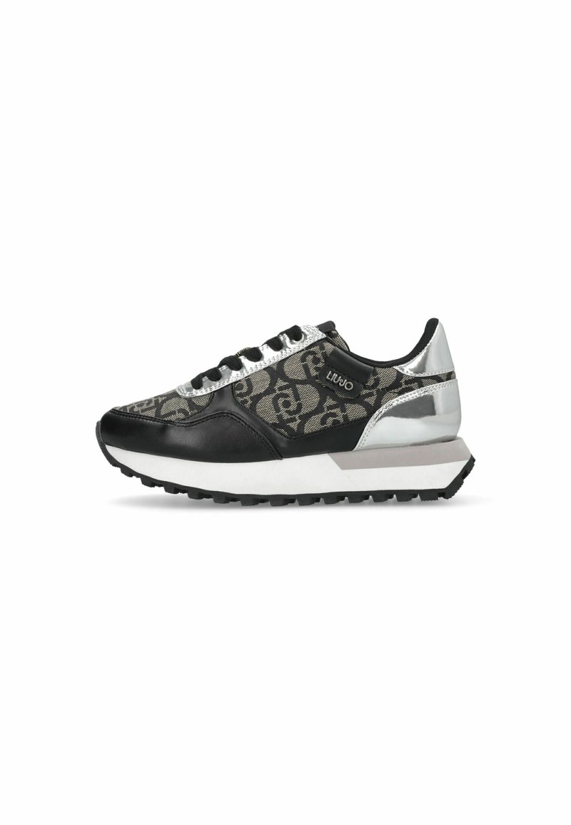 Black and gray athletic sneaker featuring a patterned upper, silver accents, reflective details, and a textured sole.
