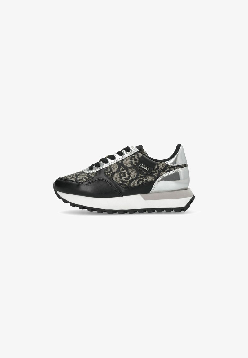 Black and gray athletic sneaker featuring a patterned upper, silver accents, reflective details, and a textured sole.