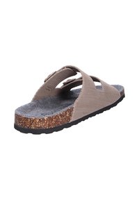 Braune Mesh-Sandalen mit zwei verstellbaren Riemen, weich gepolstertem grauen Filzfußbett und einer Korkzwischensohle auf einer strukturierten schwarzen Gummisohle.
