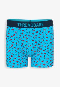 Boxer blu con motivo di ciliegie in rosso e nero, con una fascia in vita blu scuro etichettata "THREADBARE." Realizzati in tessuto morbido.