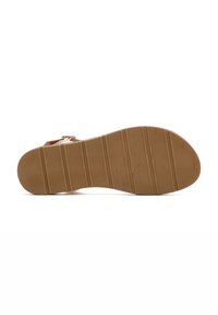 Sole della sandali in gomma marrone con scanalature e rilievi testurizzati per una presa migliore, caratterizzata da una punta arrotondata e un leggero tacco, progettata per il comfort.