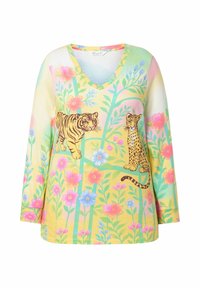 Bluzka z długim rękawem i dekoltem w serek, wykonana z miękkiego materiału, z kolorowym wzorem kwiatowym oraz motywem tygrysa i lamparta na pastelowożółtym tle.