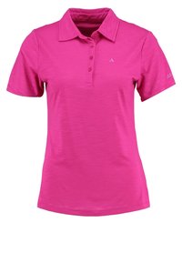 Polo rose en tissu texturé, manches courtes, avec une patte de boutonnage à trois boutons. Présente un petit logo sur la manche gauche.