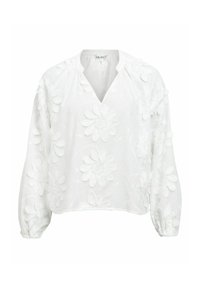 Blouse blanche à manches longues avec col en V et appliqués floraux texturés sur les manches et le corps, poignets élastiques et coupe ample.