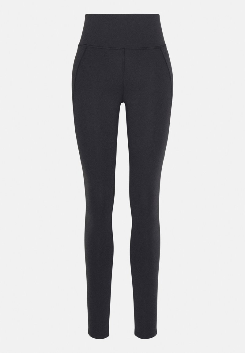 Høytibente svarte leggings med sidelommer, slim fit som smalner mot ankelen, laget av elastisk stoff.