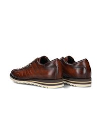 Brown leather shoes with a textured finish, featuring side stitching, a low profile, and a rubber sole with a brown and cream color scheme.