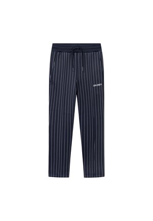 Marineblå stripete sweatpants med elastisk midje, snor og sidelommer; har logoen "LES DEUX" på nederste venstre side.