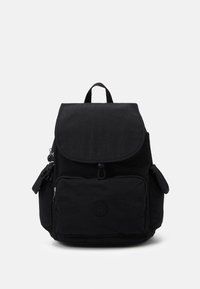 Black fabric backpack with a flap closure, front zip pocket, side pockets, and logo detail. Textured material with adjustable shoulder straps.