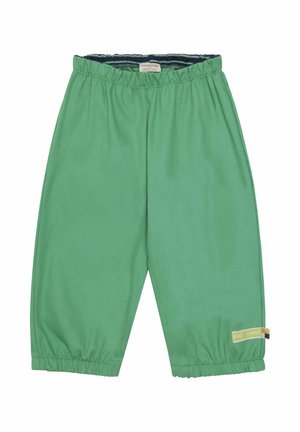 Grüne Baumwollhosen mit elastischem Bund, verkürzter Länge und elastischen Säumen. Mit einem bunten Markenschild an der Seite.