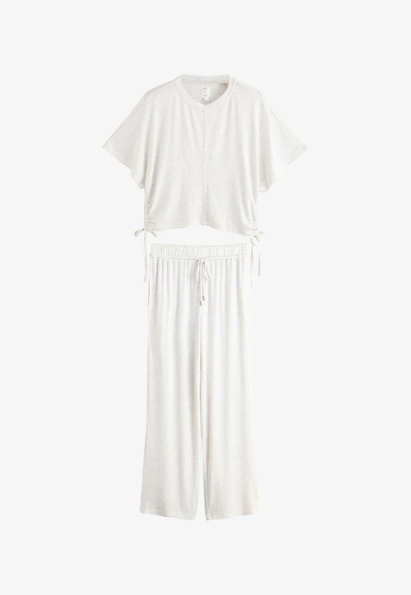 Ensemble de détente deux pièces gris clair avec un top court à manches courtes avec liens latéraux et un pantalon ample à cordon.