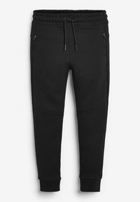 Černé joggingové kalhoty s elastickým pasem, šňůrkou, bočními zipovými kapsami a zúženými manžetami. Vyrobené z měkké směsi bavlny.