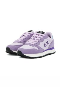 Purple suede and mesh sneakers with white soles and black rubber outsoles. Features laces, logo detailing, and a padded tongue.