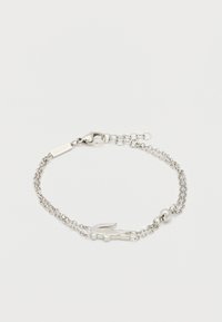 Ασημένιο βραχιόλι με διπλή αλυσίδα, κούμπωμα με καρφίτσα αστακού, ρυθμιζόμενους κρίκους, ένα μικρό στρογγυλό χάντρα και ένα μενταγιόν σε σχήμα κροκοδείλου.