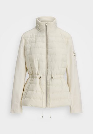 Puffer jacket in off-white. Features a high collar, zip closure, adjustable drawstring waist, and quilted texture with smooth sleeves.