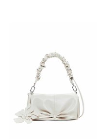 White leather handbag with a ruched handle, bow detail on the front, and a floral accent attached. Smooth texture and rectangular shape.