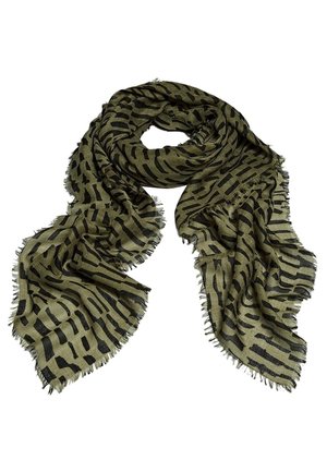 Olive green scarf with black irregular stripe pattern and frayed edges, loosely folded with flowing fabric texture.