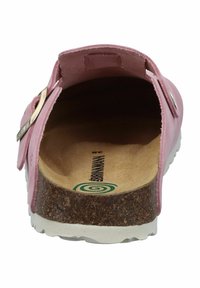 Sandalini rosa senza lacci con plantare in sughero, materiale superiore liscio, forma arrotondata e suola in gomma bianca con un motivo testurizzato.