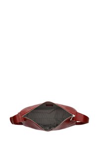 Red leather bag with a textured surface, zippered opening, and a striped fabric interior. Features a single shoulder strap.