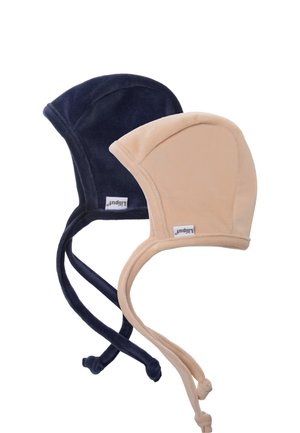 Soft cotton bonnets in navy and beige, featuring rounded tops, side flaps, and adjustable ties for secure fitting. Textured, flexible fabric.