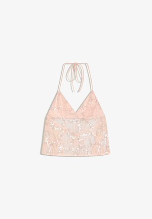 Top rosa in pizzo con paillettes, con scollatura a V profonda e sottili spalline annodate al collo.