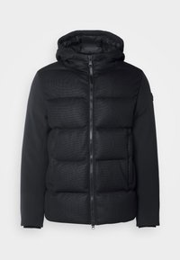 Black hooded jacket featuring a puffy quilted front and smooth sleeves. Zipper closure and textured pattern on the body.