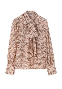 Blouse beige à manches longues avec des pois couleur rouille, dotée d'un grand nœud au niveau du col et de larges poignets.