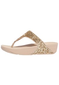 Sandale à talon compensé beige avec une sangle en paillettes dorées. Semelle intérieure anatomique et semelle texturée pour une meilleure adhérence. Design open-toe au style minimaliste.