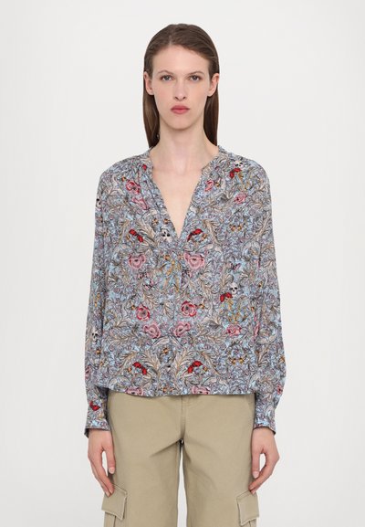 Lightweight blouse in blue, featuring a floral and skull print in pink and red, with a deep V-neckline and long sleeves.