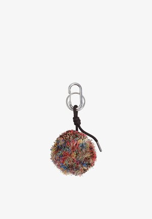 Llavero colorido y esponjoso con pompón, unido a un mosquetón plateado con un lazo de cordón negro anudado.